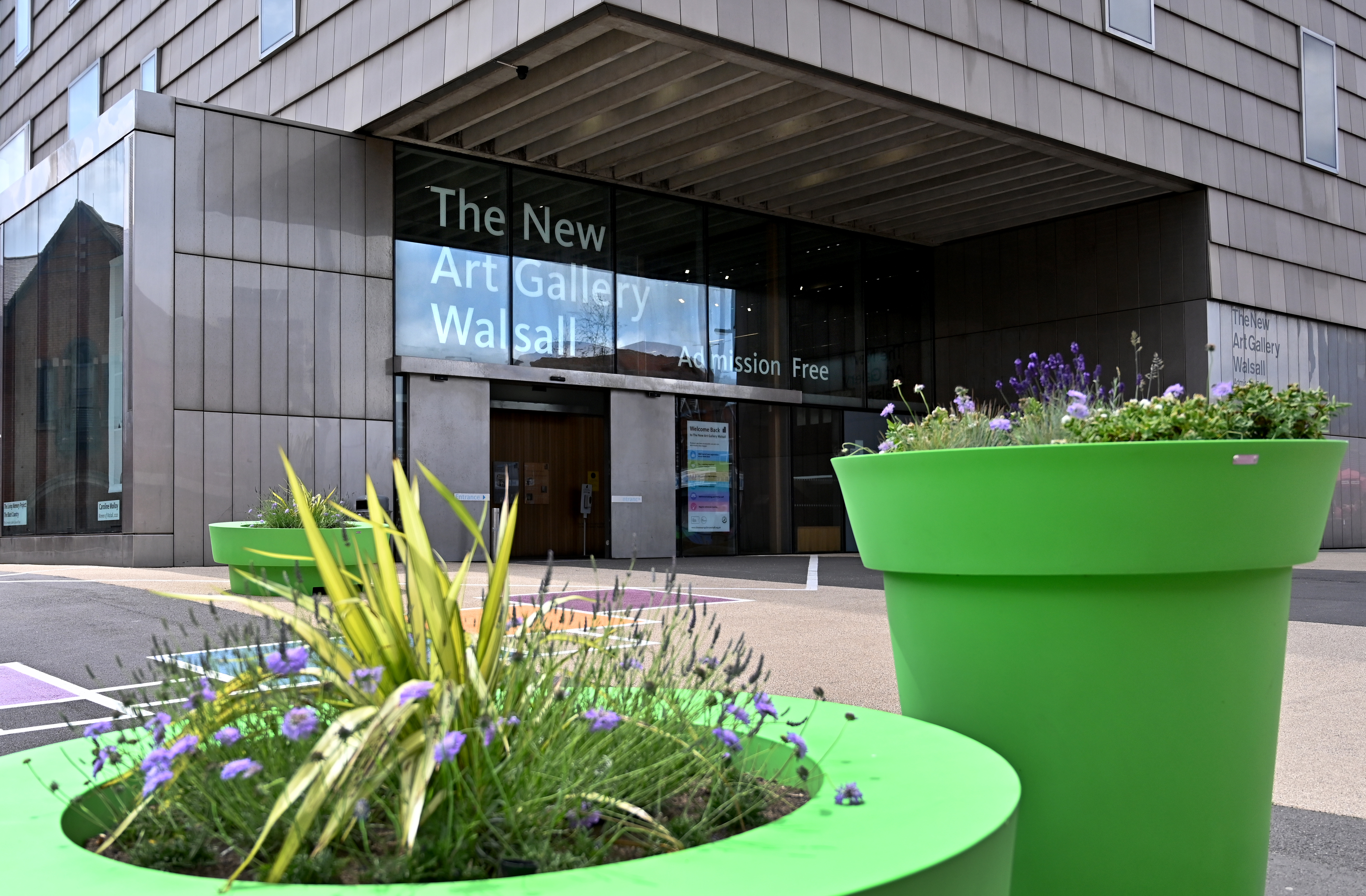 Entrance to the New Art Gallery Walsall with green planters in the foreground